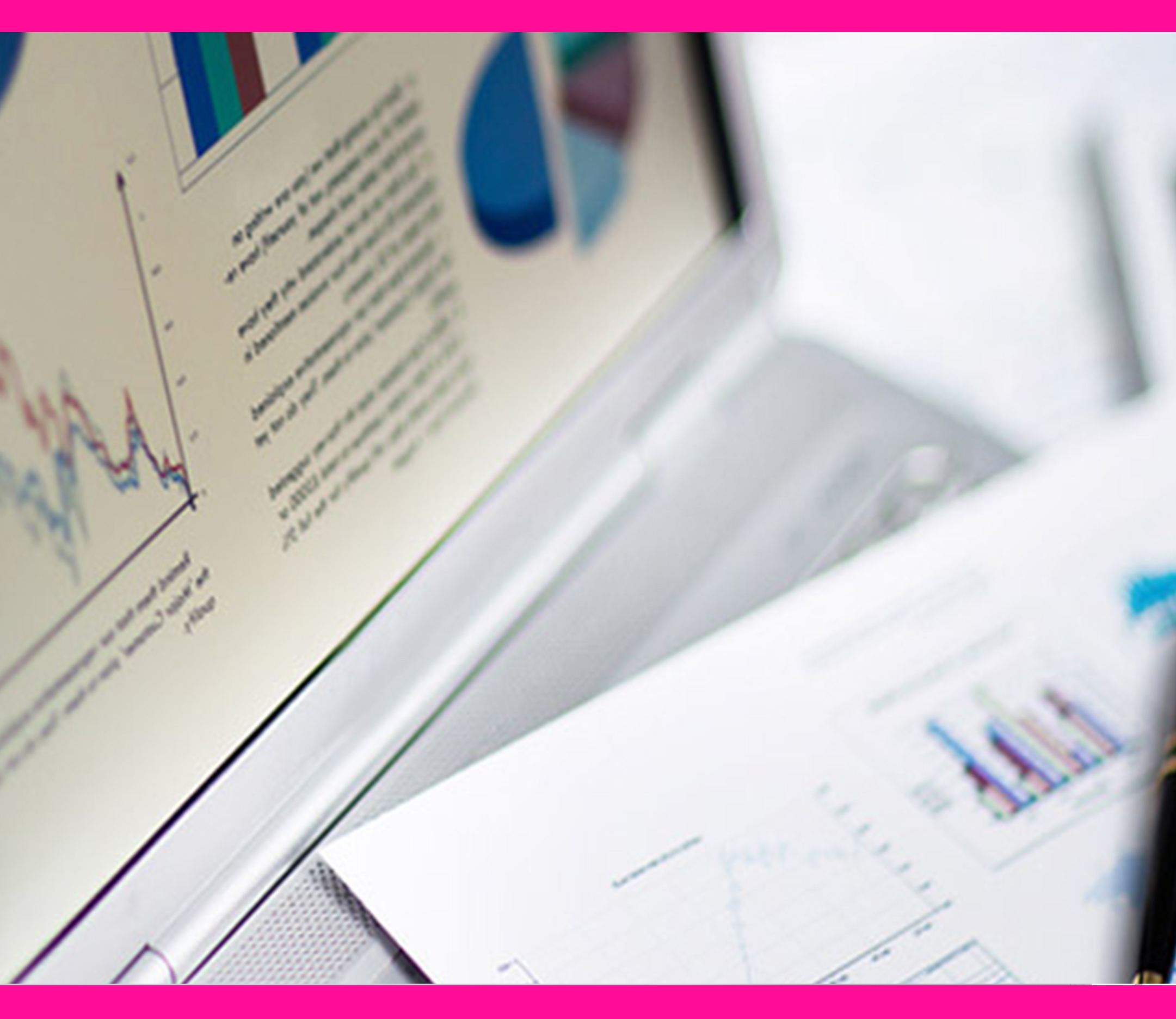 Beautiful female doctor talking on land line phone while using laptop at desk in clinic